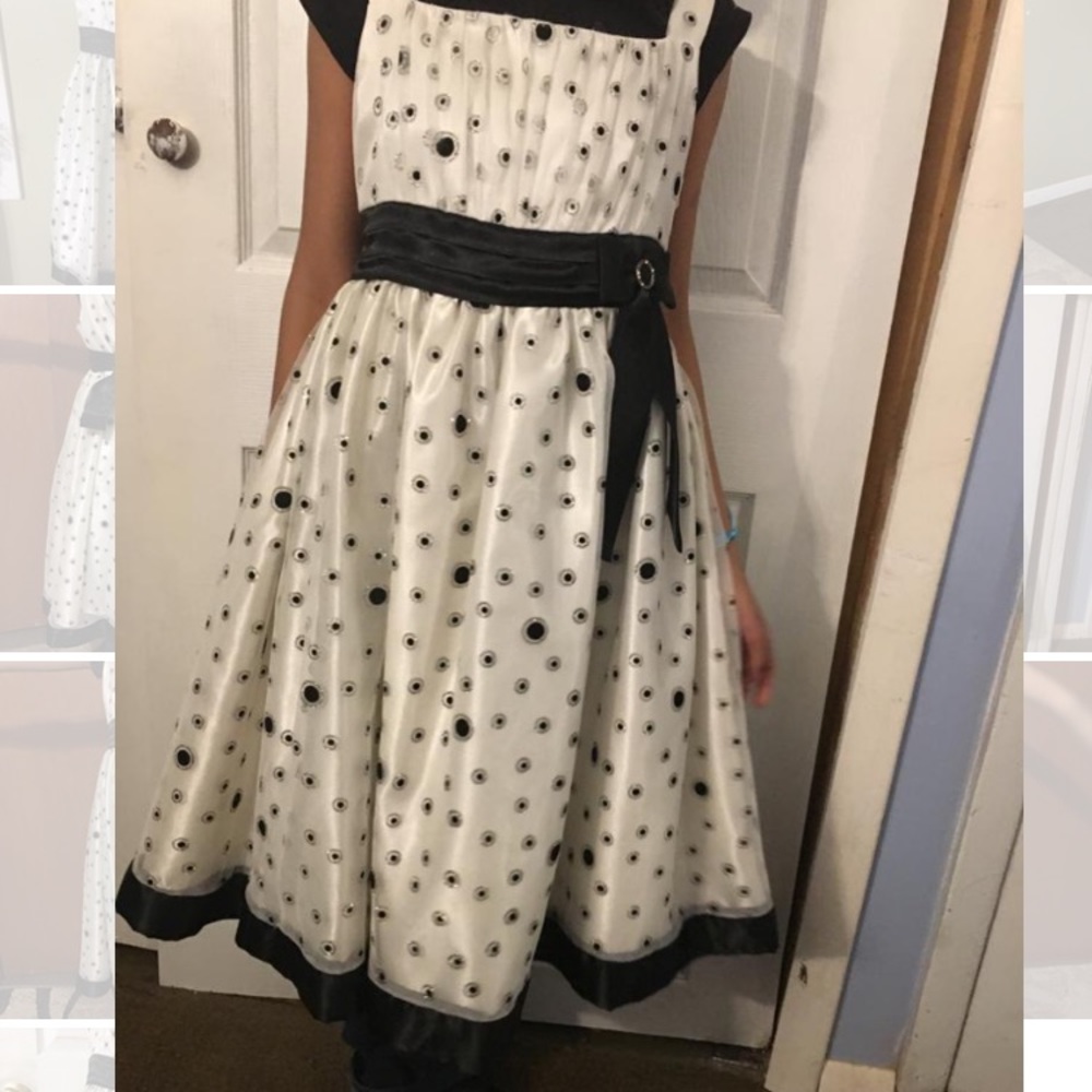 White dress with black polka dots.